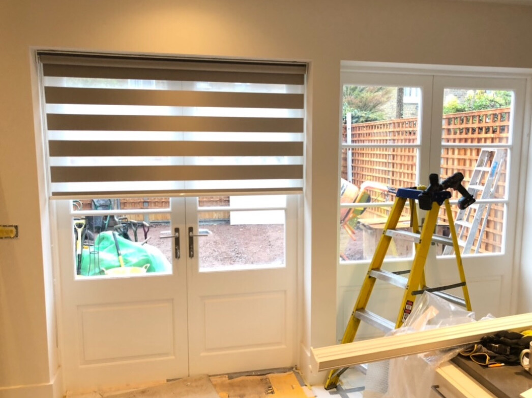 Simple, Elegant, and Functional Roller Blinds Roller blinds installed in a modern living room